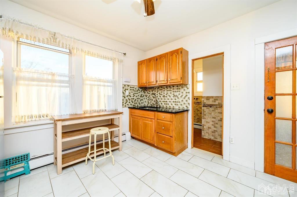 47 Marion Street Port Reading, NJ 07064 - Photo 38 of 57 a kitchen with granite countertop a stove and a sink
