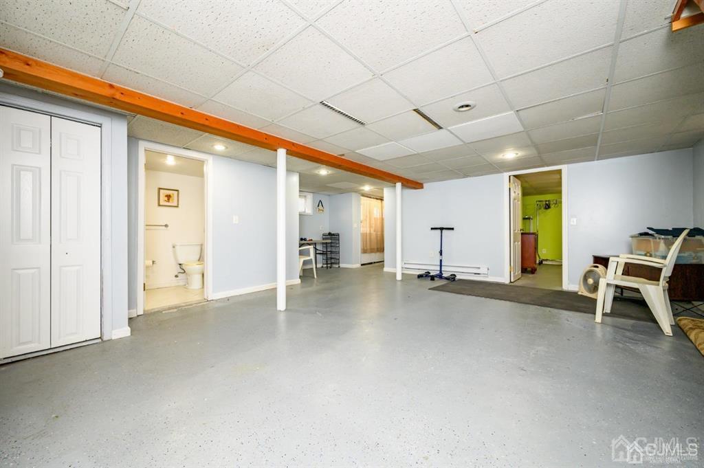47 Marion Street Port Reading, NJ 07064 - Photo 48 of 57 a view of a livingroom with gym equipment