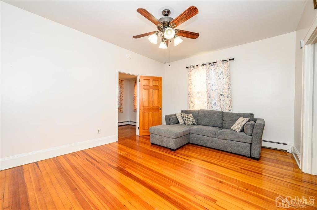 47 Marion Street Port Reading, NJ 07064 - Photo 5 of 57 a living room with furniture and a large window