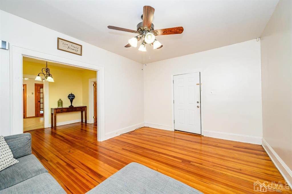 47 Marion Street Port Reading, NJ 07064 - Photo 6 of 57 a bedroom with a bed and a table