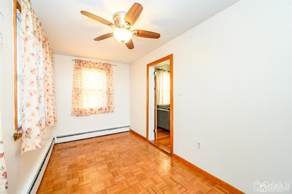 47 Marion Street Port Reading, NJ 07064 - Photo 8 of 57 a view of an empty room with a window