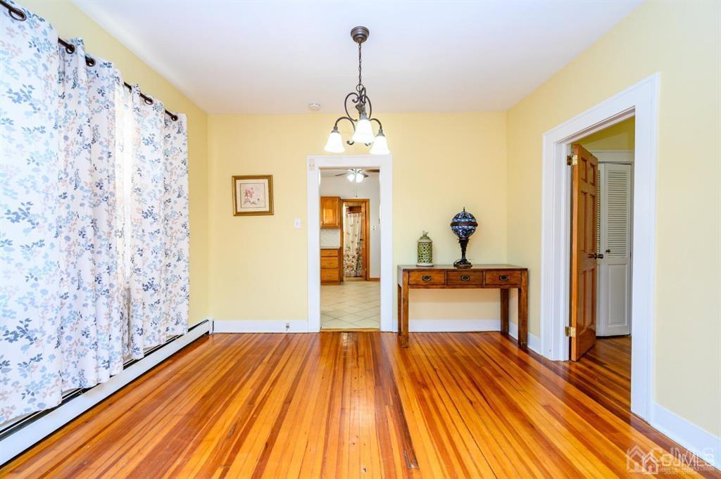 47 Marion Street Port Reading, NJ 07064 - Photo 9 of 57 a bedroom with a bed and wooden floor