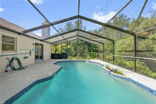 a view of a house with backyard and porch