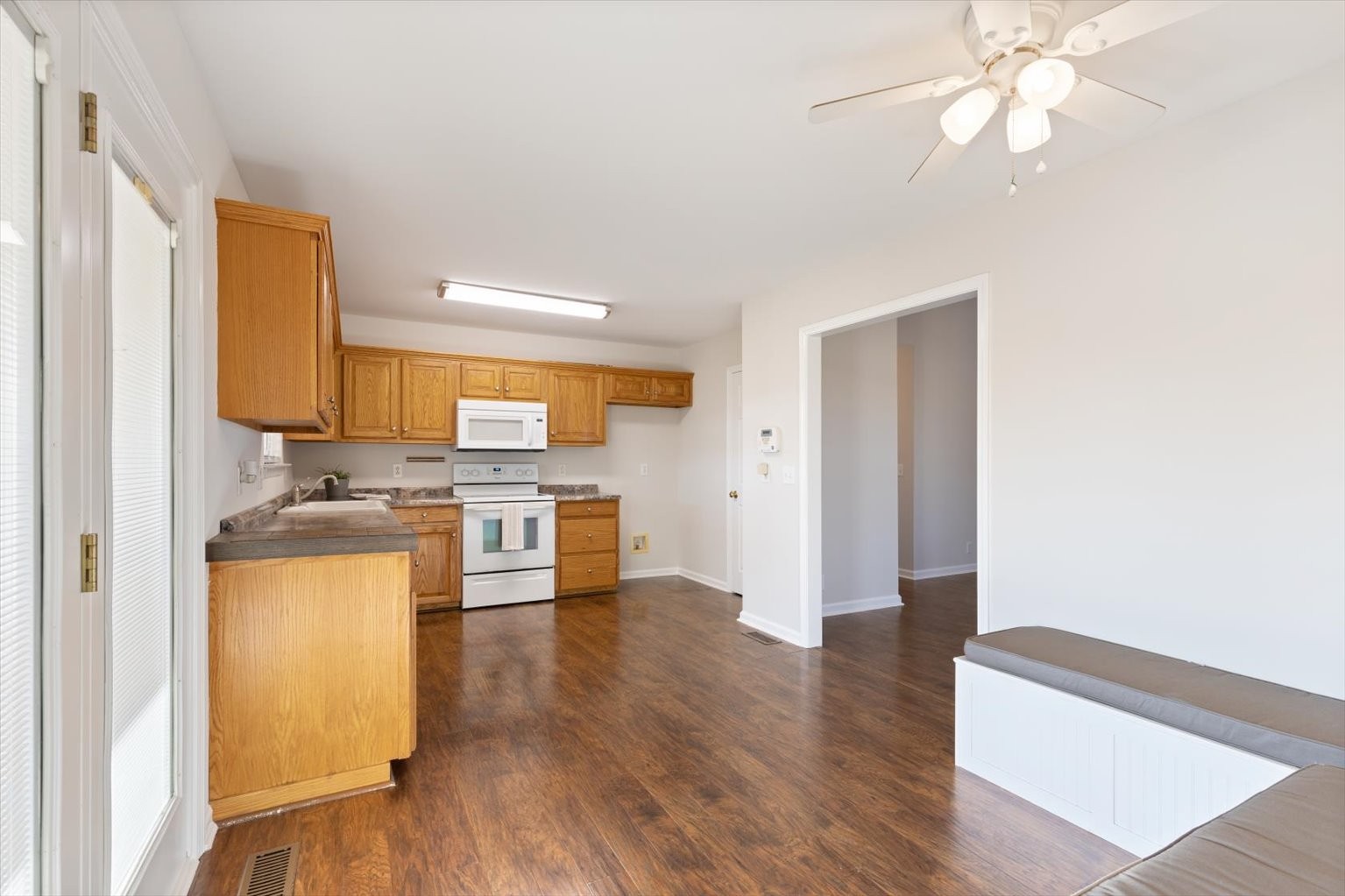 4923 Midland Fosterville Road Bell Buckle, TN 37020 - Photo 13 of 35 a kitchen with stainless steel appliances granite countertop a refrigerator and a stove top oven