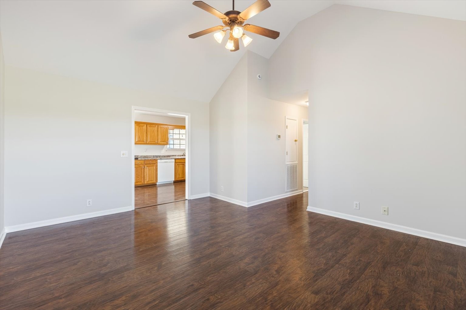 4923 Midland Fosterville Road Bell Buckle, TN 37020 - Photo 7 of 35 an empty room with wooden floor door and windows