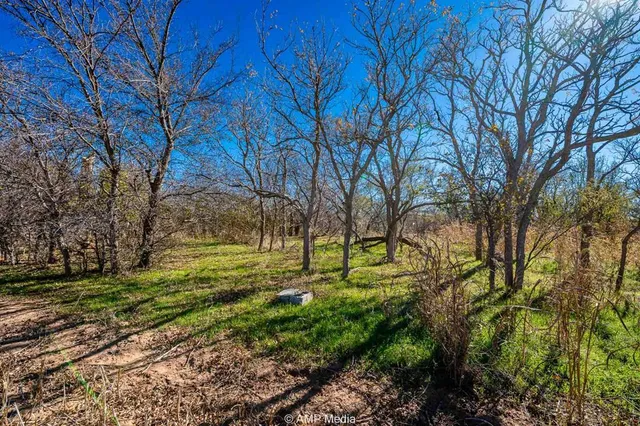 a view of a lake with a yard
