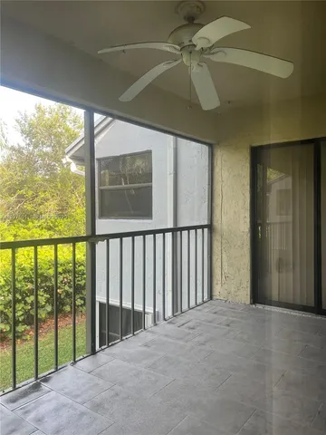 a view of a porch with a floor to ceiling window