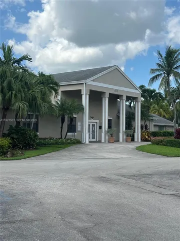 a view of a wrought iron fences in front of a house