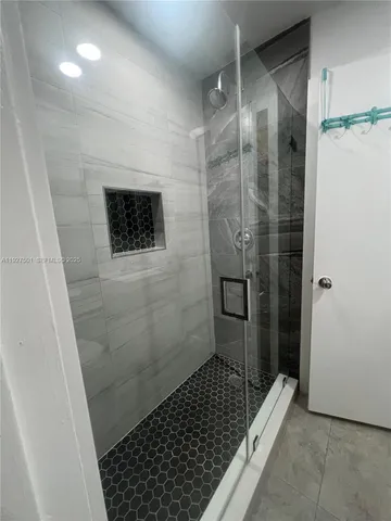a bathroom with a shower and a toilet