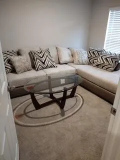 an empty room with closet and a bathroom