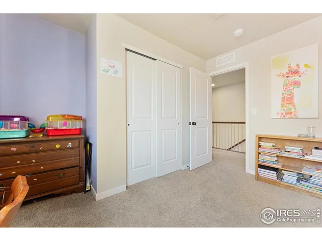 a room with toys and dresser