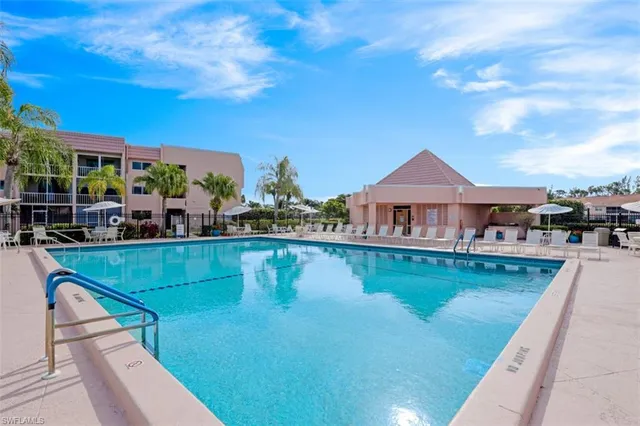 a room with furniture and floor to ceiling window