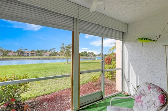 a swimming pool view with a outdoor seating