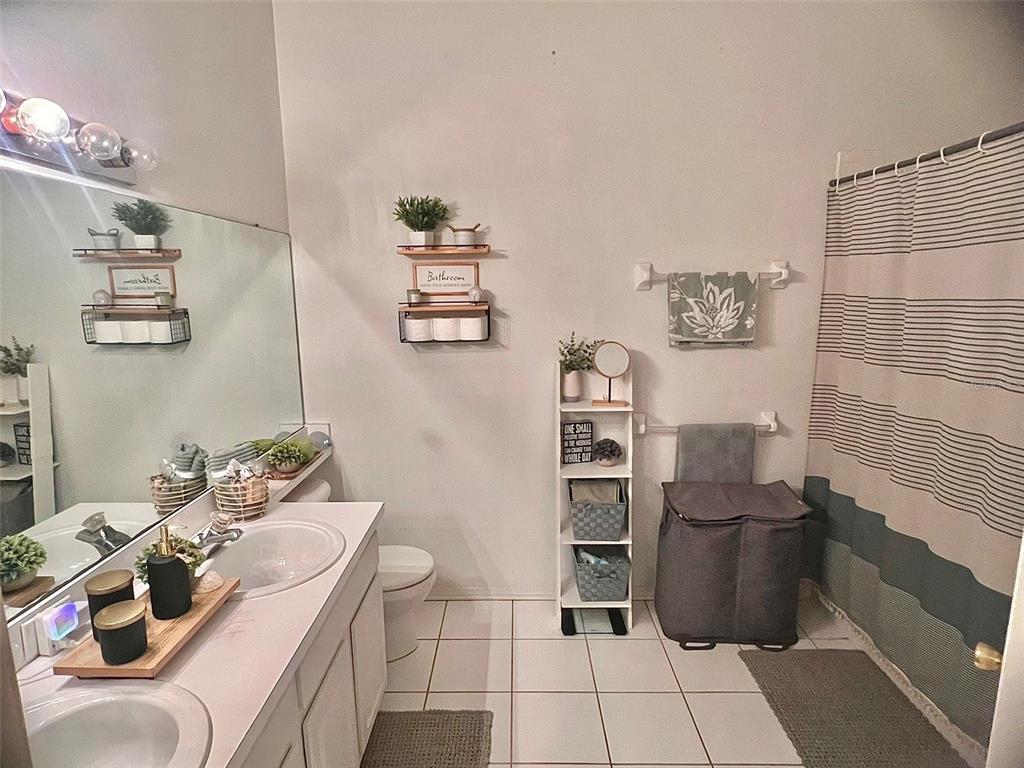 2435 Lake Woodberry Circle Brandon, FL 33510 - Photo 13 of 15 a view of a bedroom with furniture and rug