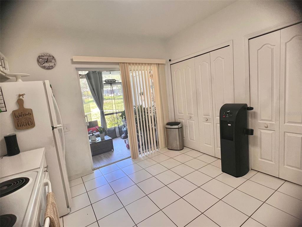 2435 Lake Woodberry Circle Brandon, FL 33510 - Photo 8 of 15 a living room with a couch and a table in it