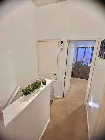 a living room with furniture and a gate