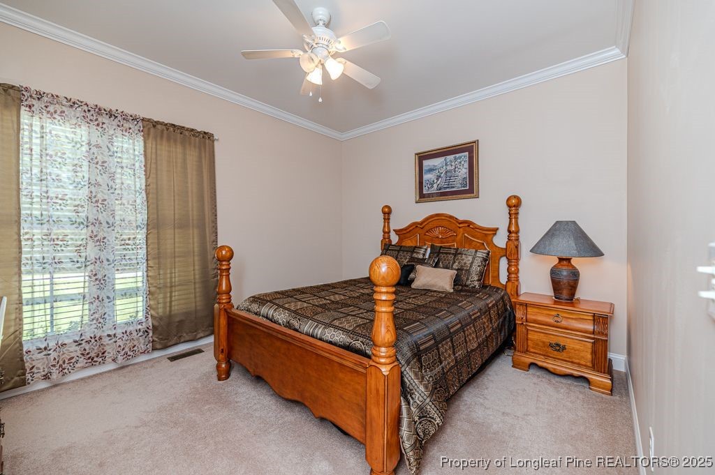 4635 Farrell Road Sanford, NC 27330 - Photo 17 of 30 a bedroom with bed and window