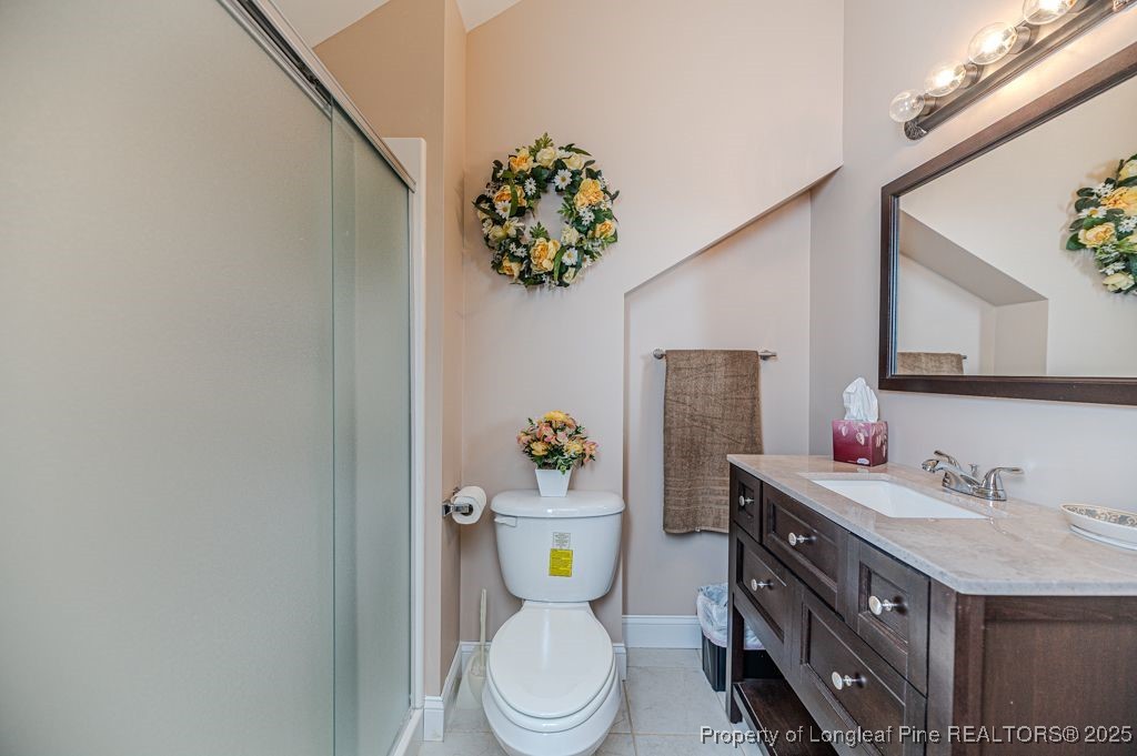 4635 Farrell Road Sanford, NC 27330 - Photo 21 of 30 a bathroom with a sink mirror vanity and toilet