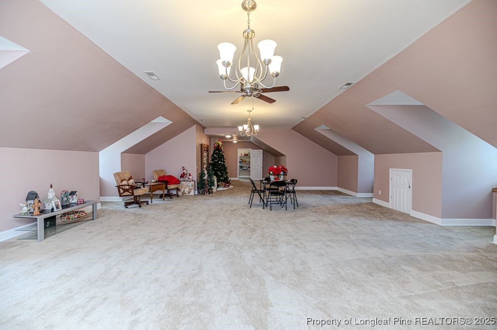 4635 Farrell Road Sanford, NC 27330 - Photo 25 of 30 a view of a room with furniture and a chandelier