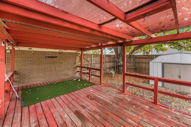 a view of porch with wooden floor
