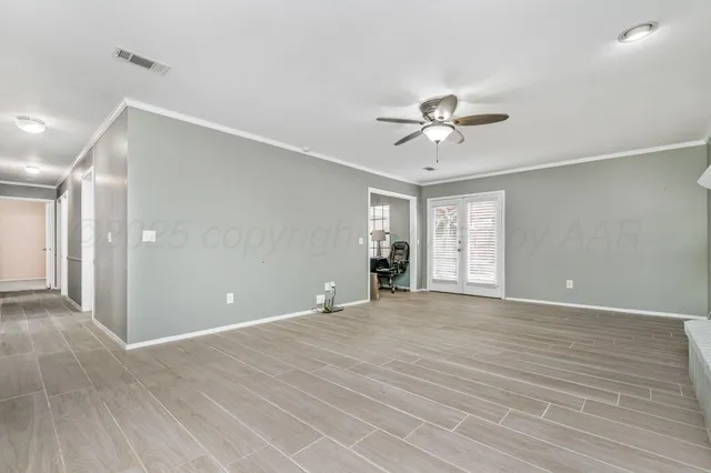 a view of an empty room with a window