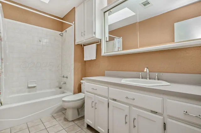 a bathroom with a sink a toilet and a bathtub