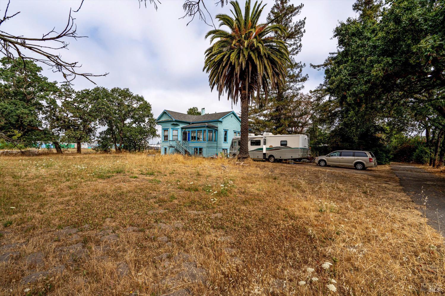 4041-4055 Sebastopol Road Santa Rosa, CA 95407 - Photo 14 of 19 a front view of a house with garden and trees