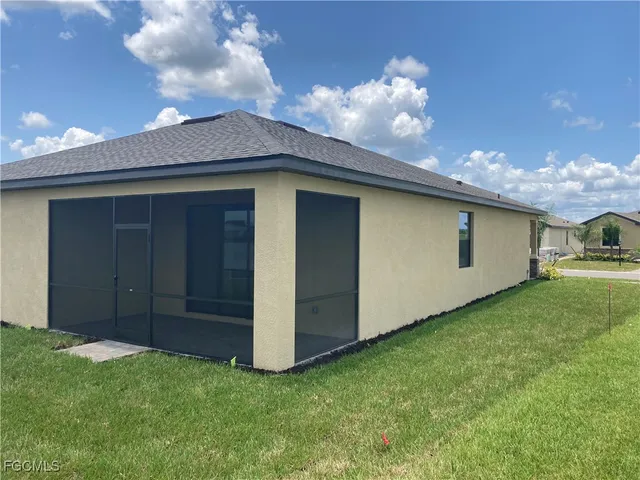 a backyard of a house with lots of green space