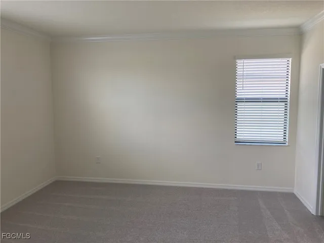 a bathroom with a granite countertop sink a toilet a mirror and bathtub
