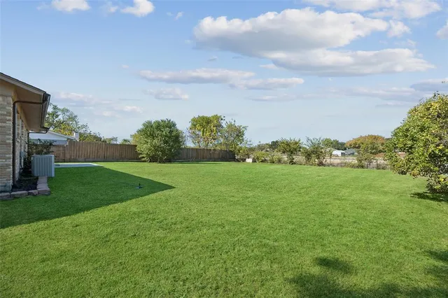 a view of building with yard
