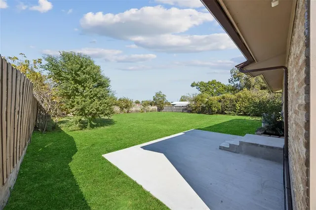 a view of a garden with a houses