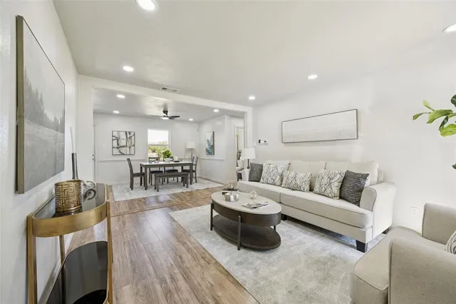 a living room with furniture and a table