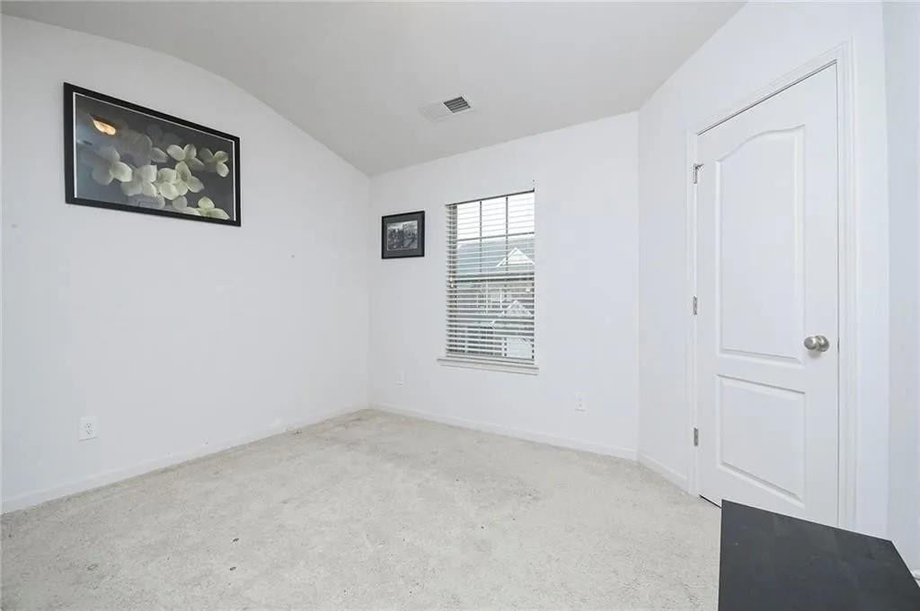 3934 Princeton Lakes Pass Southwest Atlanta, GA 30331 - Photo 5 of 35 a view of an empty room with a window