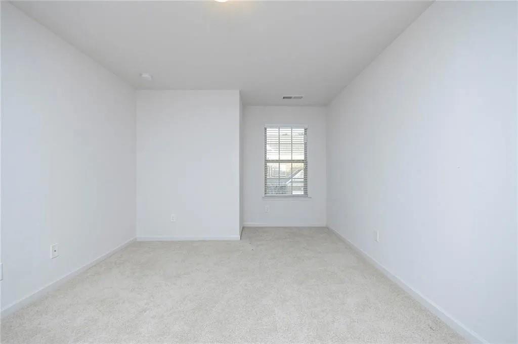 3934 Princeton Lakes Pass Southwest Atlanta, GA 30331 - Photo 6 of 35 an empty room with a window