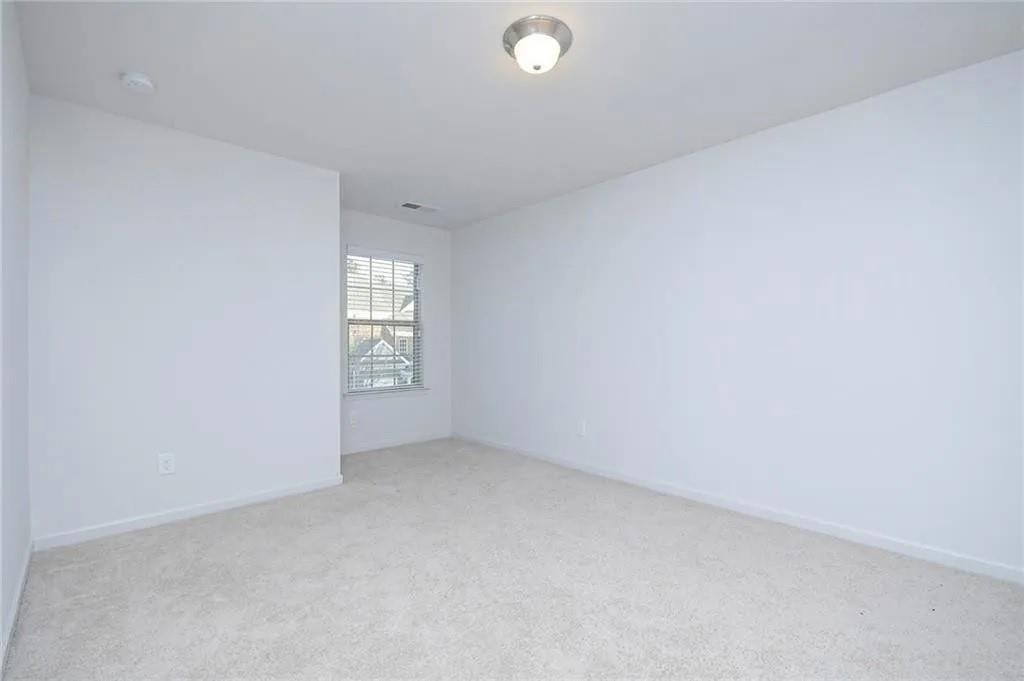 3934 Princeton Lakes Pass Southwest Atlanta, GA 30331 - Photo 8 of 35 an empty room with windows
