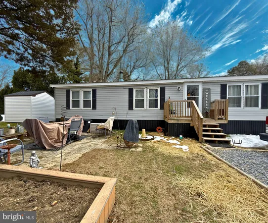 a view of a house with backyard porch and sitting area
