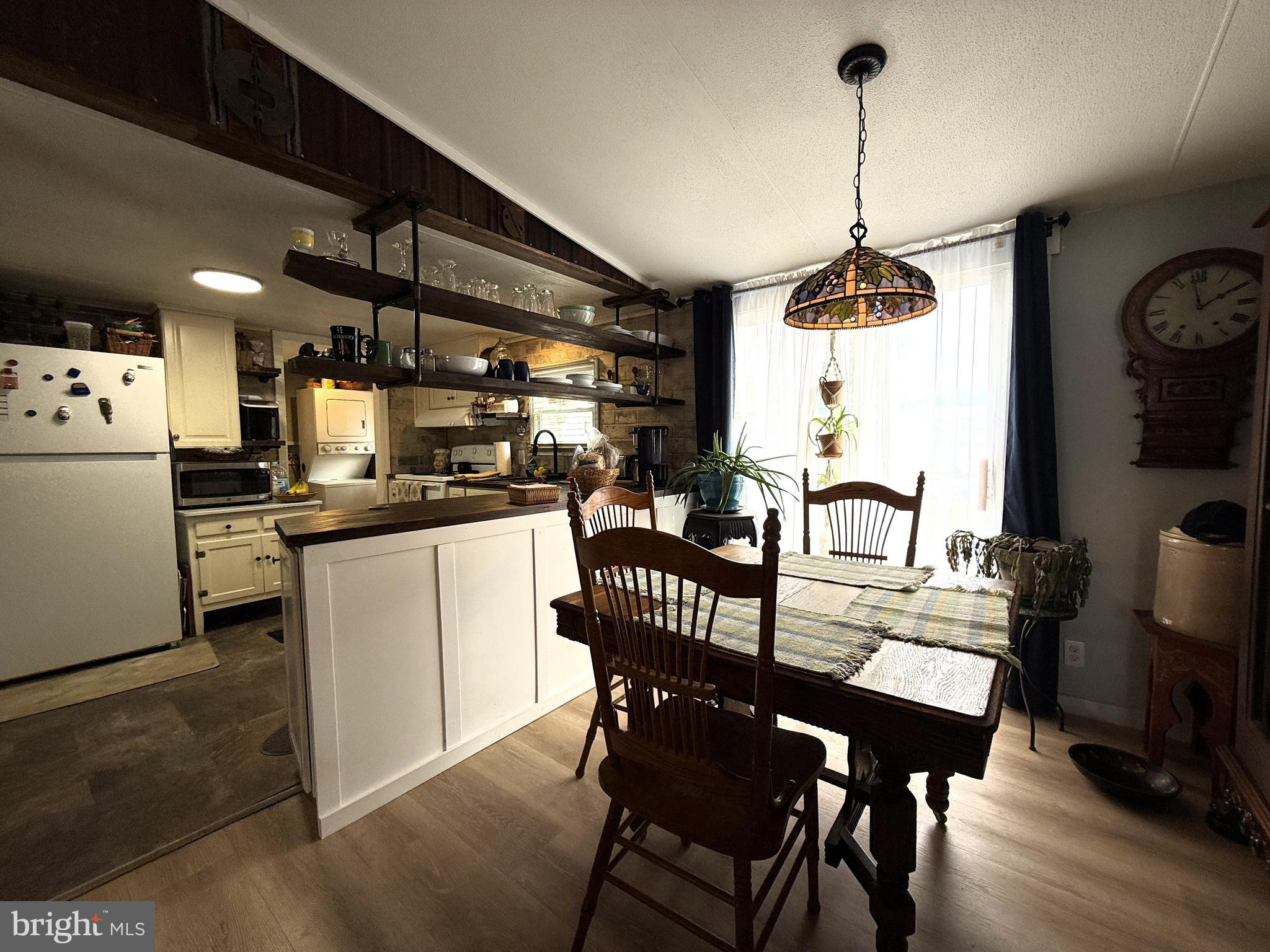 260 Marshall Mill Road, Unit 146 Malaga, NJ 08328 - Photo 14 of 34 a dining room with furniture and window