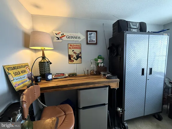a room with a table chairs and a dresser