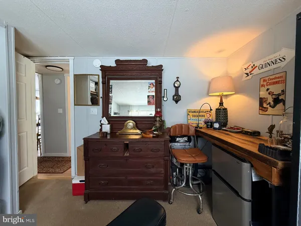 a bed room with furniture and a flat screen tv