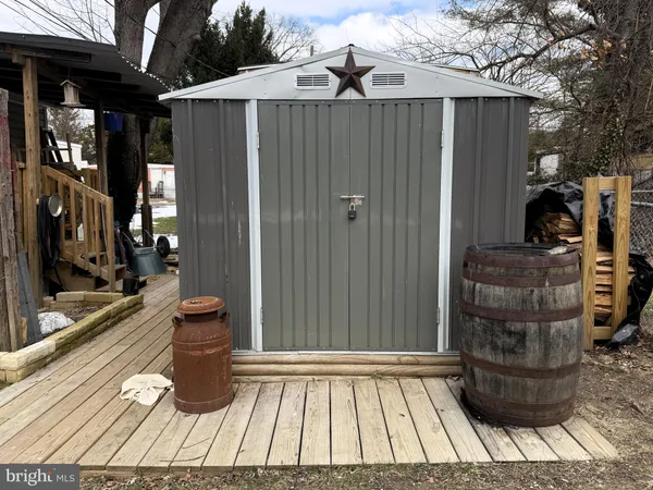 a utility room with two washing machine and deck