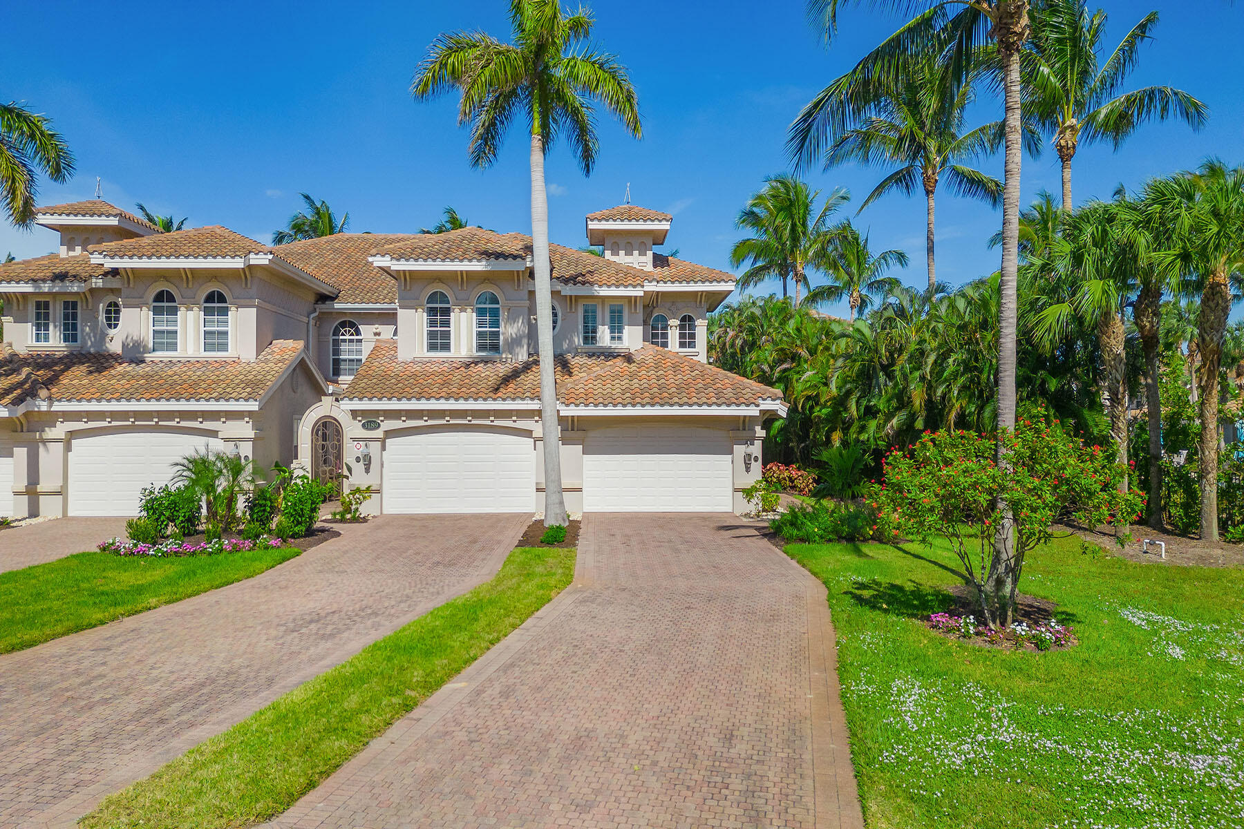 3189 Aviamar Circle, Unit 202 Naples, FL 34114 - Photo 33 of 50 a front view of house with yard and green space