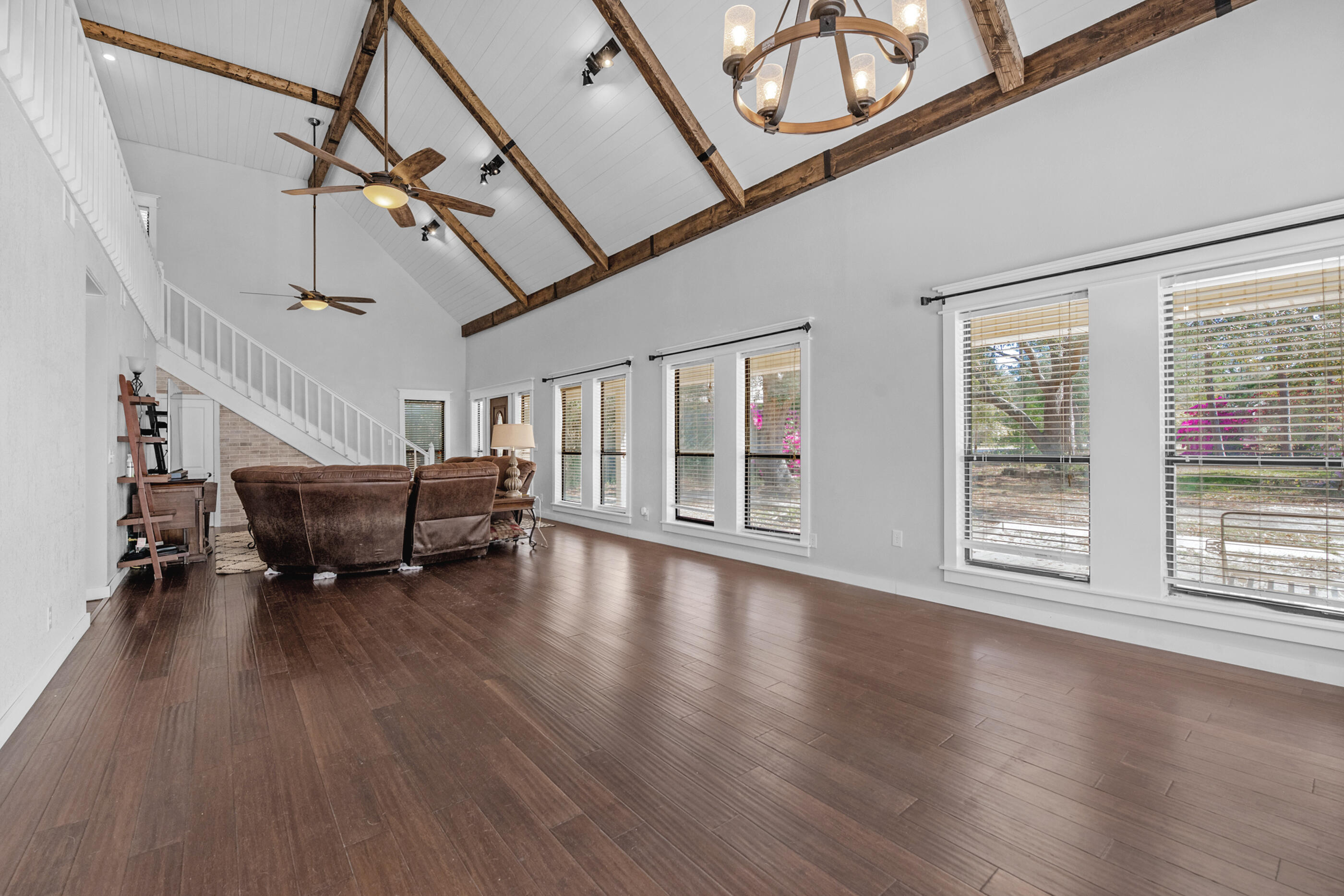 6539 Robar Tesora Street Navarre, FL 32566 - Photo 11 of 48 a view of livingroom with hardwood floor and window