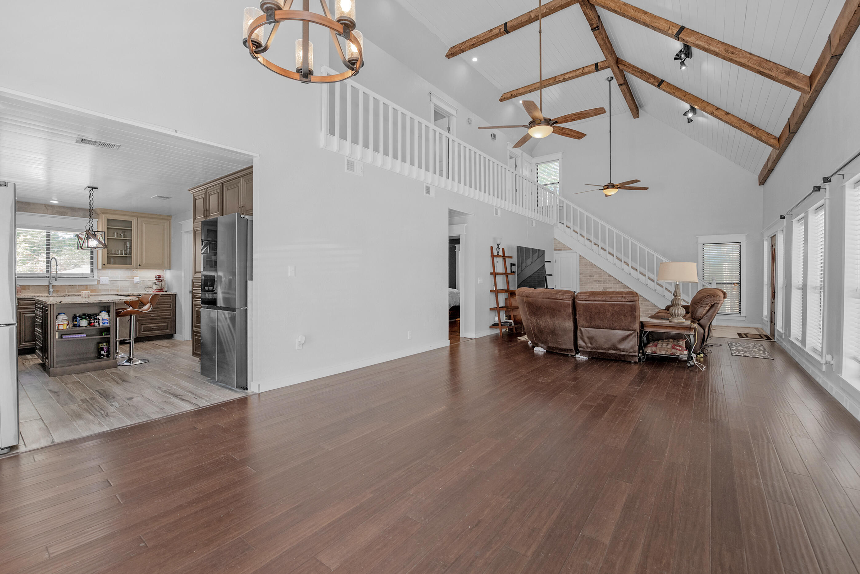 6539 Robar Tesora Street Navarre, FL 32566 - Photo 13 of 48 a living room with furniture and a wooden floor