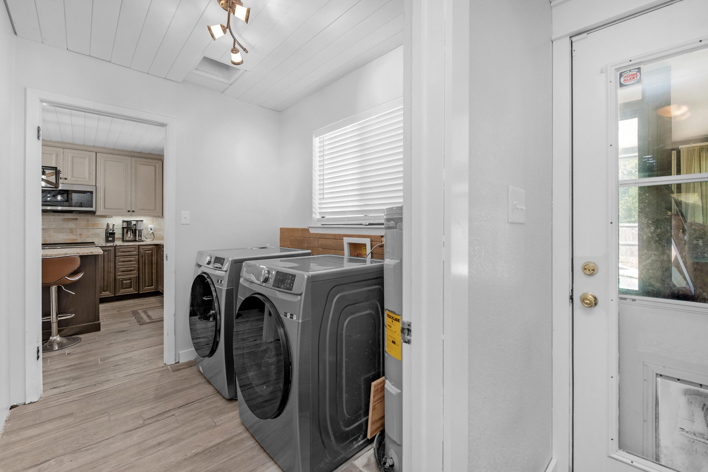 6539 Robar Tesora Street Navarre, FL 32566 - Photo 30 of 48 a view of livingroom with washer and dryer