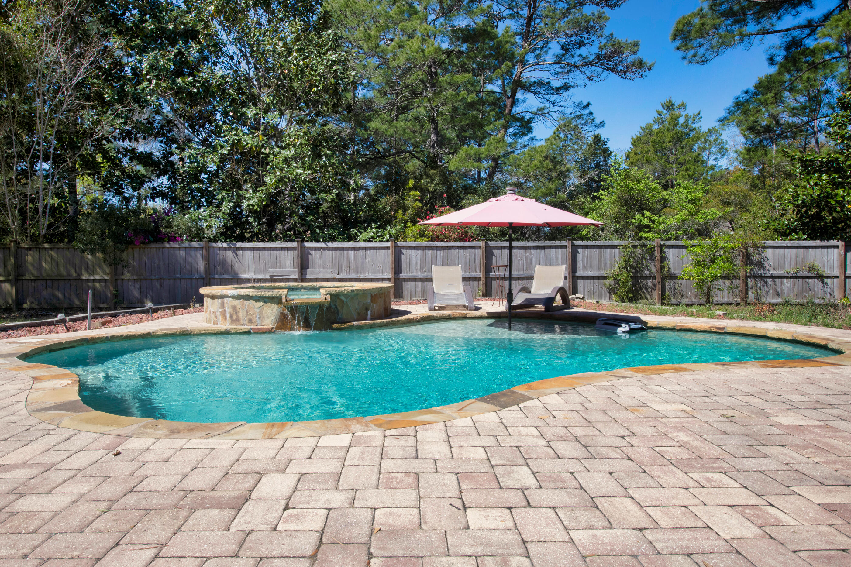 6539 Robar Tesora Street Navarre, FL 32566 - Photo 32 of 48 a view of a swimming pool with a patio