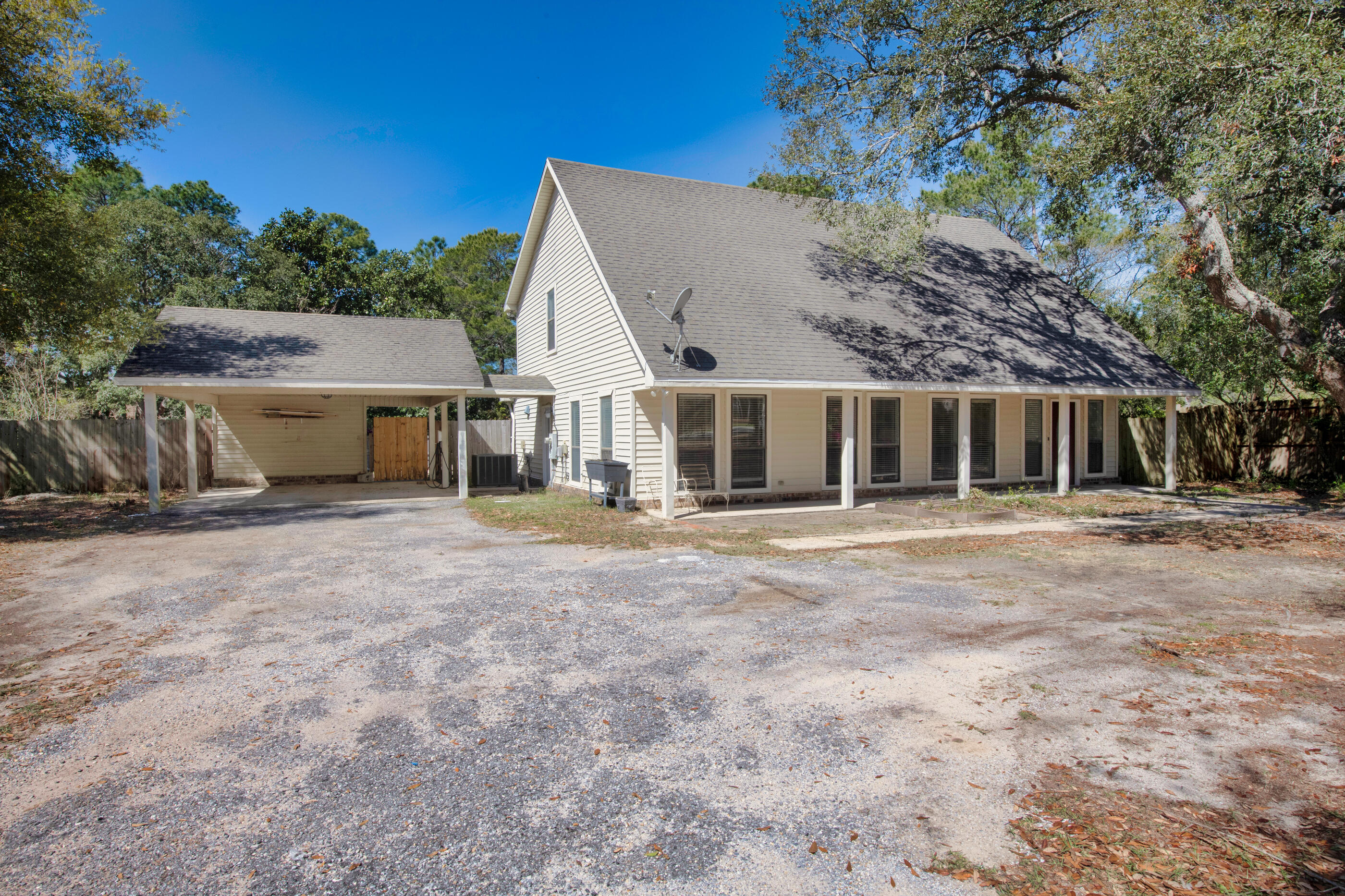 6539 Robar Tesora Street Navarre, FL 32566 - Photo 6 of 48 front view of a house with a yard