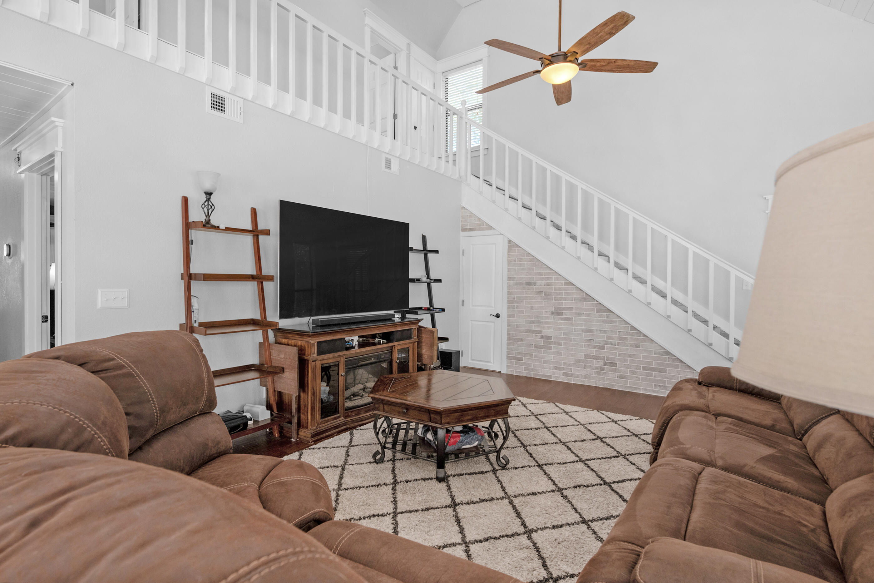 6539 Robar Tesora Street Navarre, FL 32566 - Photo 10 of 48 a living room with furniture and a flat screen tv