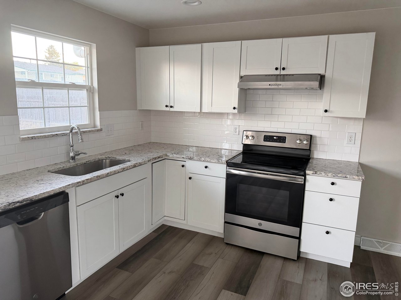 2814 West 22nd Street Road Greeley, CO 80634 - Photo 2 of 27 Recently remodeled kitchen with stainless steel appliances and granite countertops