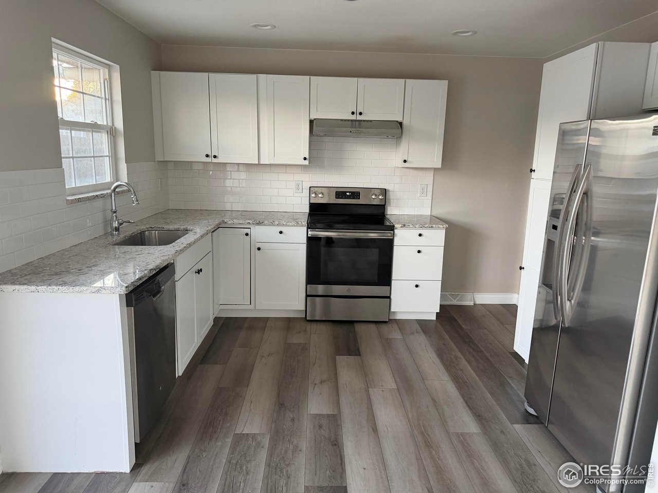 2814 West 22nd Street Road Greeley, CO 80634 - Photo 3 of 27 Recently remodeled kitchen with stainless steel appliances and granite countertops