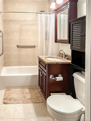 a bathroom with a sink a toilet and bathtub